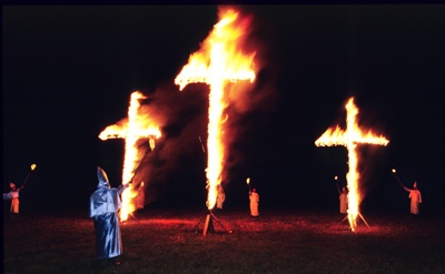 Ku Klux Klan stages a cross burning in western Greene County Missouri in the early 1990's. (Copyright John S. Stewart/LEFTeyeSTORIES.com)